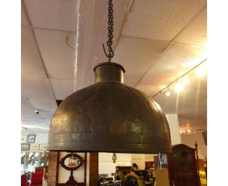 A large industrial ceiling light shade 