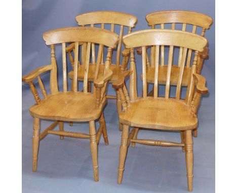 A set of four 20th century light oak chairs 