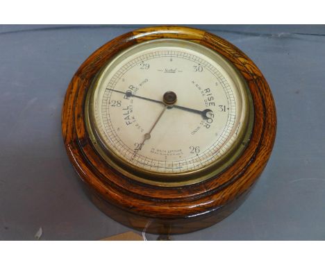A Sestrel oak marine barometer, diameter 22cm 