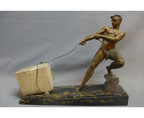 A J. DE RONCOURT ART DECO COLD-PAINTED SPELTER FIGURE CIRCA 1930 modelled and cast as a man draging a concrete boulder, mount