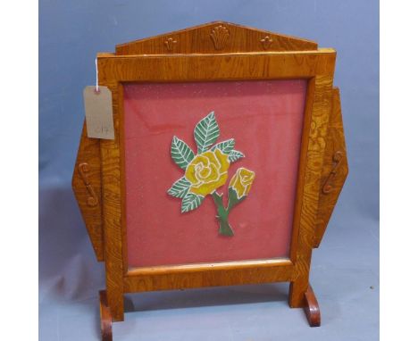 An Art Deco fire screen with central rose 