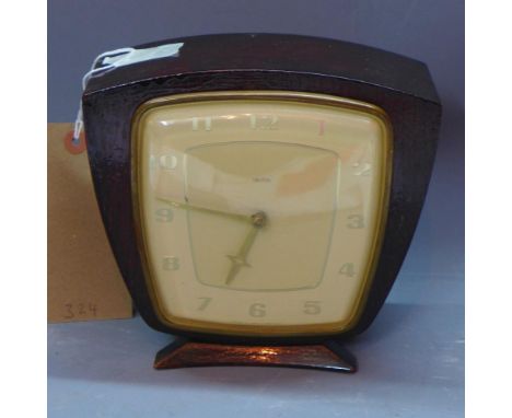 An Art Deco oak mantle clock, the cream dial with Arabic numerals, (missing gong), with key, H. 19cm 