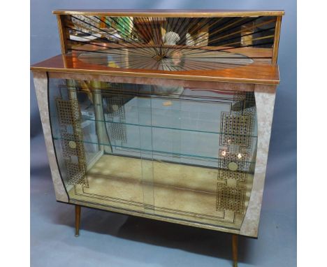 A 1950's display cabinet, having mirrored back with shining star design, two sliding glass doors revealing single glass shelf