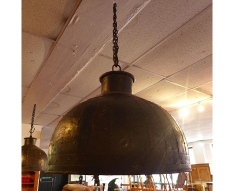 A large industrial ceiling light shade 