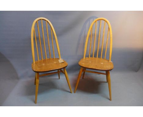 A pair of Ercol elm stickback dining chairs, raised on splayed legs and stretchers, bear stamps, H. 98cm (2) 