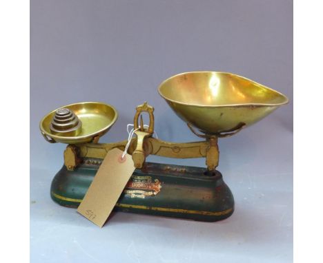 A set of J & J. Siddons kitchen scales, with five weights 
