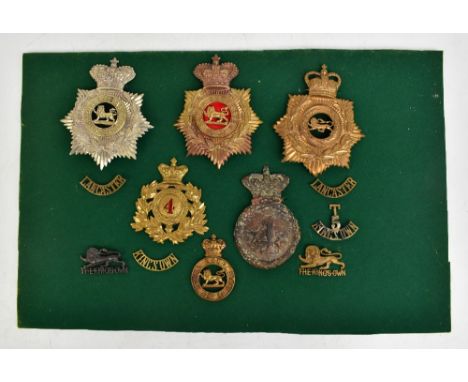 THE KING'S OWN ROYAL REGIMENT (ROYAL LANCASTER); four helmet/shako plates including First Volunteer Battalion and IVth of Foo