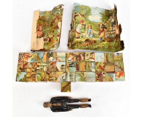 A carved wooden Folk Art articulated jig/jigger doll, length 19cm, together with a part puzzle.Additional InformationHeavily 