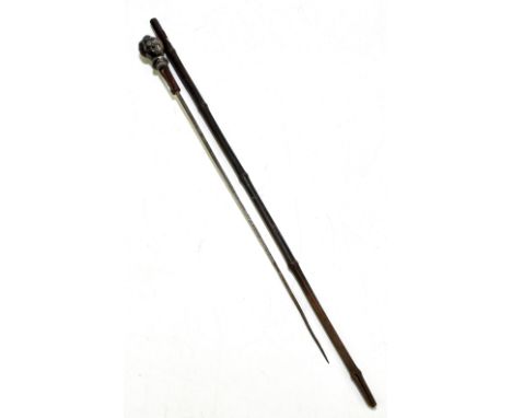 A late 19th century sword stick, with applied grotesque gentleman's head finial with bamboo shaft, length 69.5cm (af).Additio