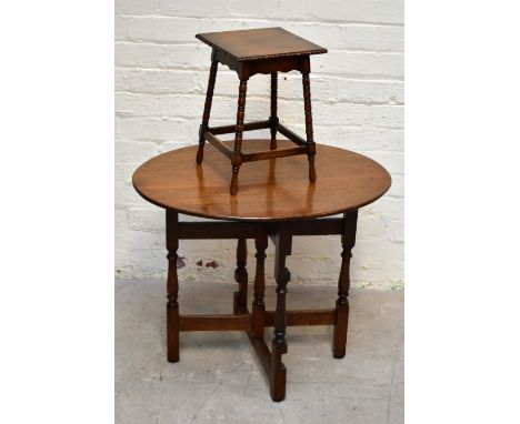 An early 20th century oak folding oval table, with turned legs, height 62cm, length 74cm, width 57cm, with an Edwardian oak s