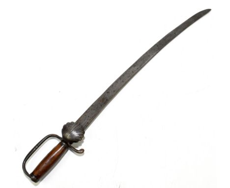 A 19th century or earlier German hunting hanger, the curved blade length 62.5cm, to shell guard and walnut grip (lacking scab