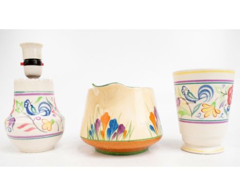 CLARICE CLIFF; a 'Crocus' pattern jug, height 11cm, and a Poole Pottery vase and a Poole Pottery lamp (3).Additional Informat