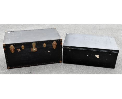 A black painted metal twin handled trunk of rectangular form, length 91cm, depth 53cm, height 36cm, together with a similar c