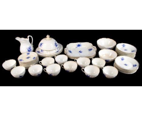 COALPORT; a forty seven piece part tea and dinner service, pattern no.3128, with moulded over painted blue floral detail, a n