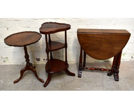 A small Edwardian mahogany Sutherland table with turned column supports, height 54, width 50cm, with a reproduction mahogany 