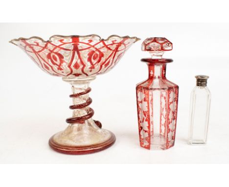 A 19th century Bohemian painted and gilt glass pedestal dish with shaped rim and modelled with an entwined snake around the c