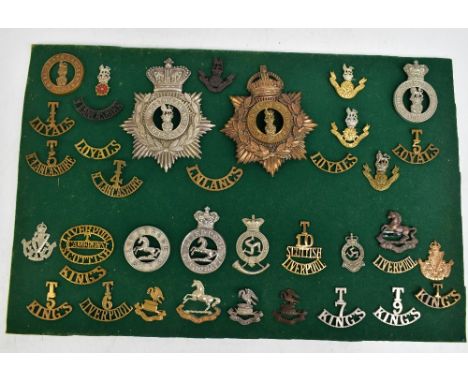 THE LOYAL NORTH LANCASHIRE REGIMENT; a good group of badges including two helmet/shako plates, a Second Volunteer Battalion c