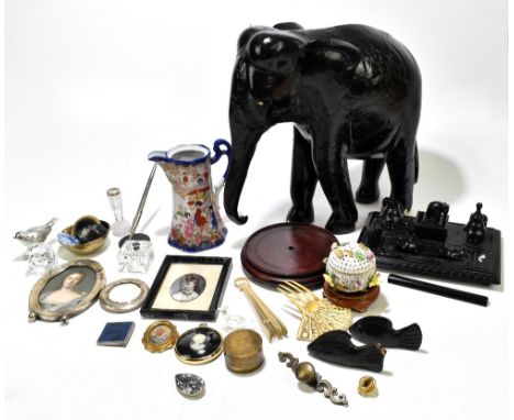 A mixed group of assorted collectors' items including a large ebonised model of an elephant, height 41cm, a similar desk stan