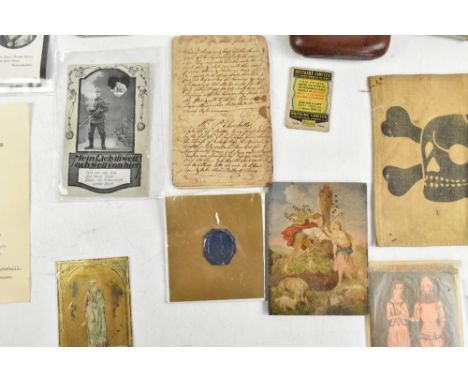 A group of militaria items&nbsp;including postcards, an officer's whistle, a&nbsp;hallmarked silver cigarette case with engin