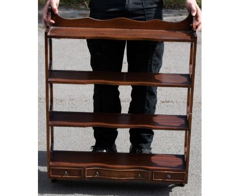 A set of reproduction mahogany hanging shelves with pierced open sides and three drawers to the base, height 92cm, width 96cm