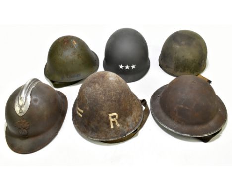 Six WWII and later helmets including a Brodie, American, French, further example labelled 'R' with chevrons, etc (6).Provenan