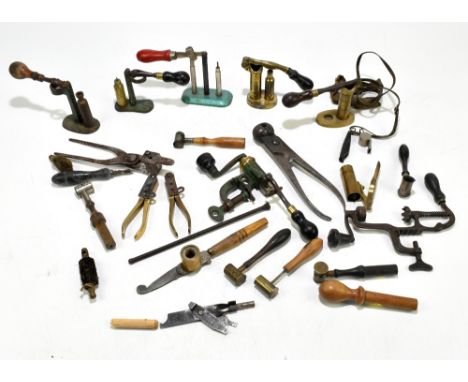 A group of cartridge making equipment and related tools including bullet moulds, etc, some stamped.Provenance: The Captain Al