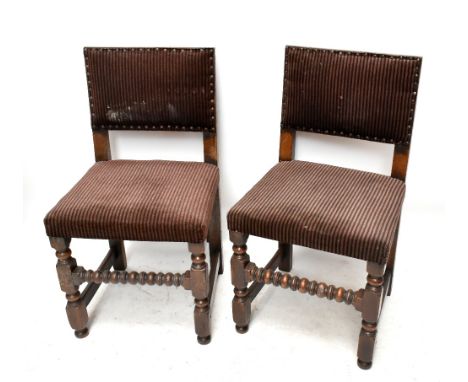 A harlequin set of six oak framed dining chairs, raised on block and bobbin supports, with central ringed stretcher, upholste