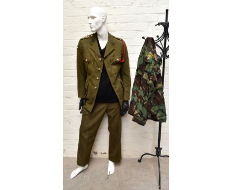 A No.2 dress military tunic with buttons and Tank Corps badges and trousers displayed on a mannequin included in the lot, als