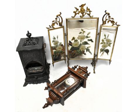 A 19th century brass framed triptych firescreen, with three mirrored plates with painted floral detail, height 84cm, and a ca