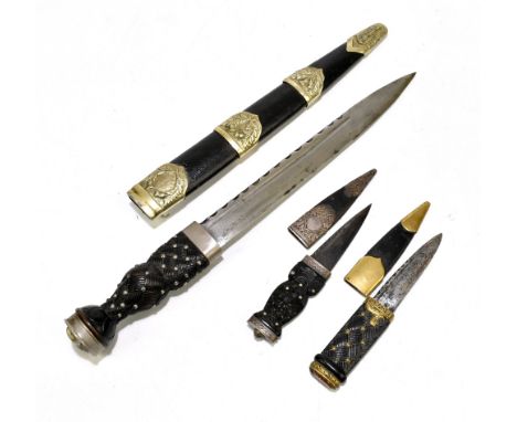 A Scottish Regimental bandman's dirk with crown to pommel, blade length 28cm (unmarked), and two sgian-dubh examples, the fir