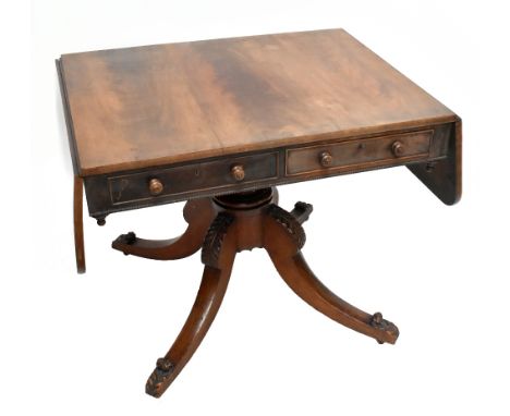An early 19th century mahogany sofa table, with two frieze drawers, with carved undertier, raised on turned baluster supports