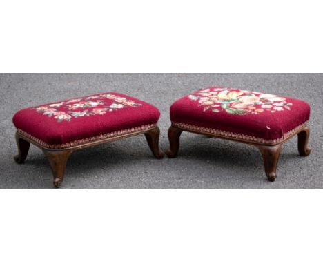 A near pair of early 20th century carved walnut footstools, of rectangular form with tapestry seats, on cabriole legs, the la