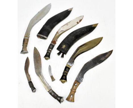 Five kukri knives, one stamped to the blade base 'HW45', two with scabbards and two smaller related knives (7).Provenance: Th