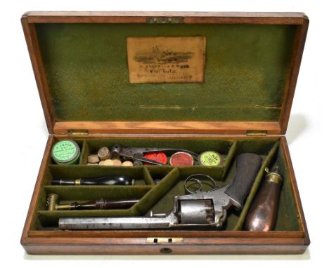 A cased 19th century percussion cap five shot revolver with 6.5" octagonal barrel, with simple foliate engraving and checkere