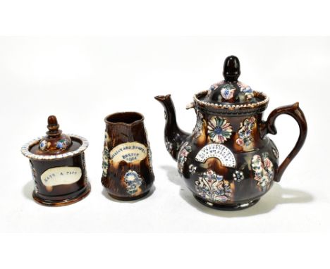 BARGEWARE; a large 19th century teapot and cover with relief decoration and plaque inscribed 'A Present to Mr &amp; Mrs Jacks