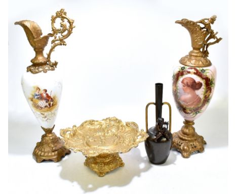 An early 20th Rococo style century gilt metal pedestal comport, with cast detail depicting a central cherub flanked by scroll