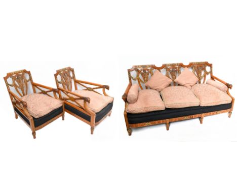 ATTRIBUTED TO HILLE; a c.1900 satinwood and parcel gilt three-piece bergère suite comprising settee and matching armchairs, e