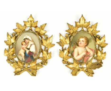 A pair of late 19th century Continental porcelain plaques, one painted with cupid, the other with a mother and infant, each i