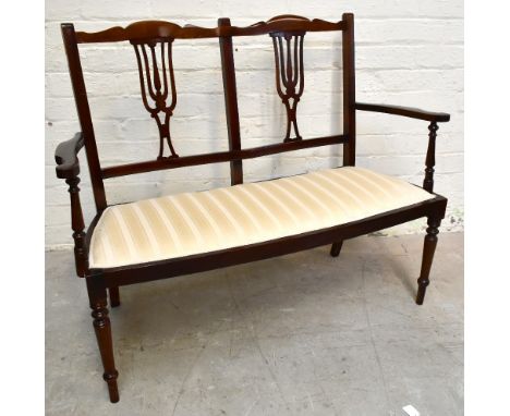 An&nbsp;Edwardian&nbsp;mahogany salon settee, with striped upholstery, on turned legs,&nbsp;height 90cm,&nbsp;width 107cm,&nb