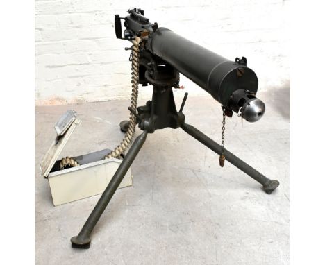 VICKERS; a Mk I .303 water cooled machine gun, mounted on a tripod with various broad arrow stamps and stamps to the top of t