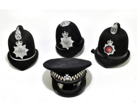 Three Police helmets with Staybrite badges and mounts, the first for Greater Manchester Police by Custodian Helmet of Oxfords