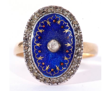 Vintage blue enamel and diamond ring, the blue enamel plaque 18 x 14mm, highlighted with gold and red border, centres an old 