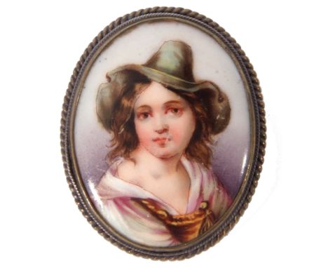Vintage hand painted porcelain brooch of oval form depicting a young lady in a green hat, framed in a gilt metal mount (a/f)