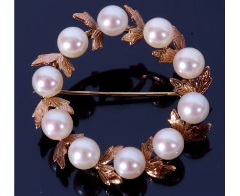 9ct gold and cultured pearl brooch, a garland of ten pearls between chased leaves, diam 3.5cm, Birmingham 1975