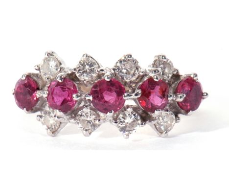 18ct white gold small size ruby and diamond cluster ring featuring a line of five circular cut rubies raised between two rows