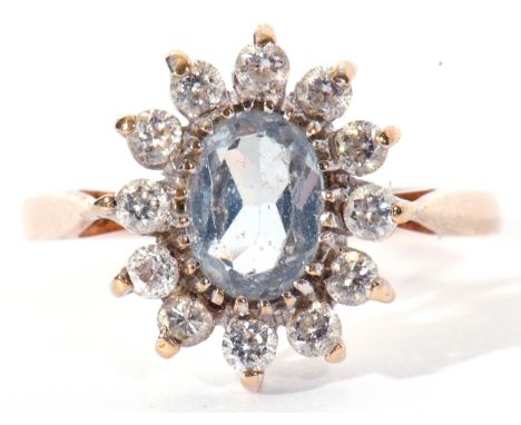 9ct gold and paste set cluster ring, the light blue coloured centre stone surrounded by 12 small pastes, makers mark S&amp;K,