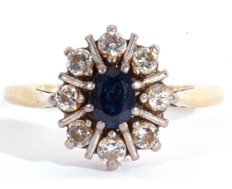 Sapphire and diamond cluster ring, the oval faceted sapphire 6 x 4mm within a round brilliant cut diamond surround (8), diamo