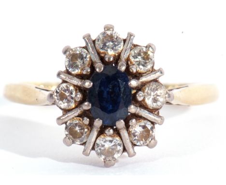 Sapphire and diamond cluster ring, the oval faceted sapphire 6 x 4mm within a round brilliant cut diamond surround (8), diamo