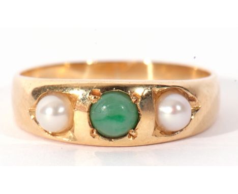 18ct stamped jade and seed pearl ring, centring a small jade bead flanked by two small seed pearls, each individually in engr