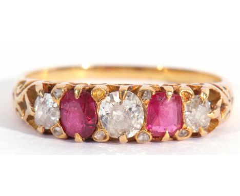 Antique diamond and ruby five stone ring, alternate set with graduated old cut diamonds and two oval cut rubies, each individ